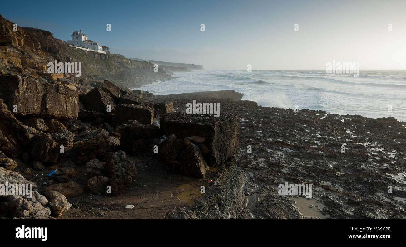Soft mudstone cliffs erode into the Atlantic in southern Portugal. Stock Photo