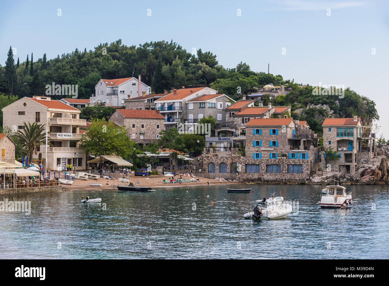 Houses over small bay in Przno resort village on the Adriatic Sea coast near Budva city Montenegro Stock Photo