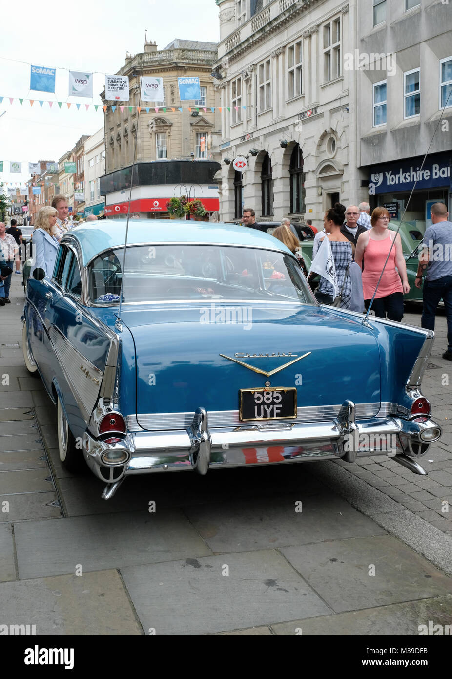 Retro Day in the streets of Gloucester. Classic motor vehicles and period costumes in Gloucester's 'gate' streets.1957 Chevrolet BelAir sedan. Stock Photo