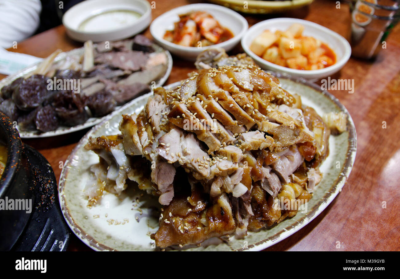 Focus on the Korean style braised pork belly with the side dishes at