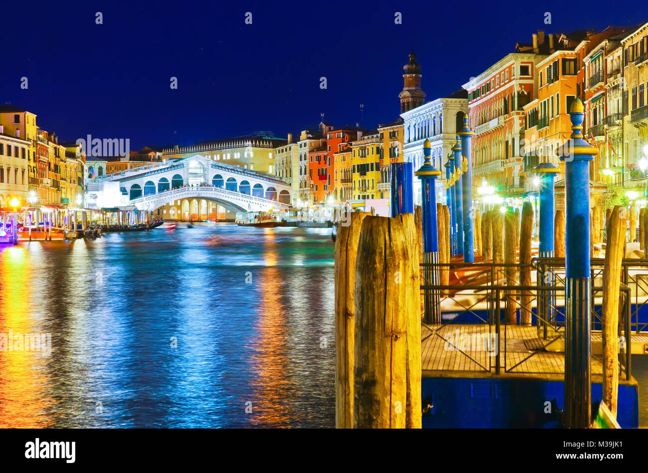 View of the Rialto Bridge and Grand Canal in Venice at night. Stock Photo
