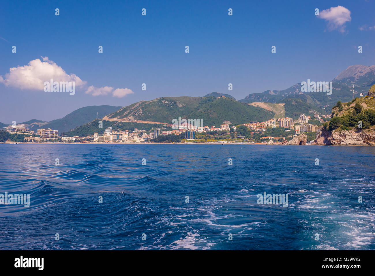 Distance view of Becici town within Budva Municipality over Adriatic coast in Montenegro Stock Photo