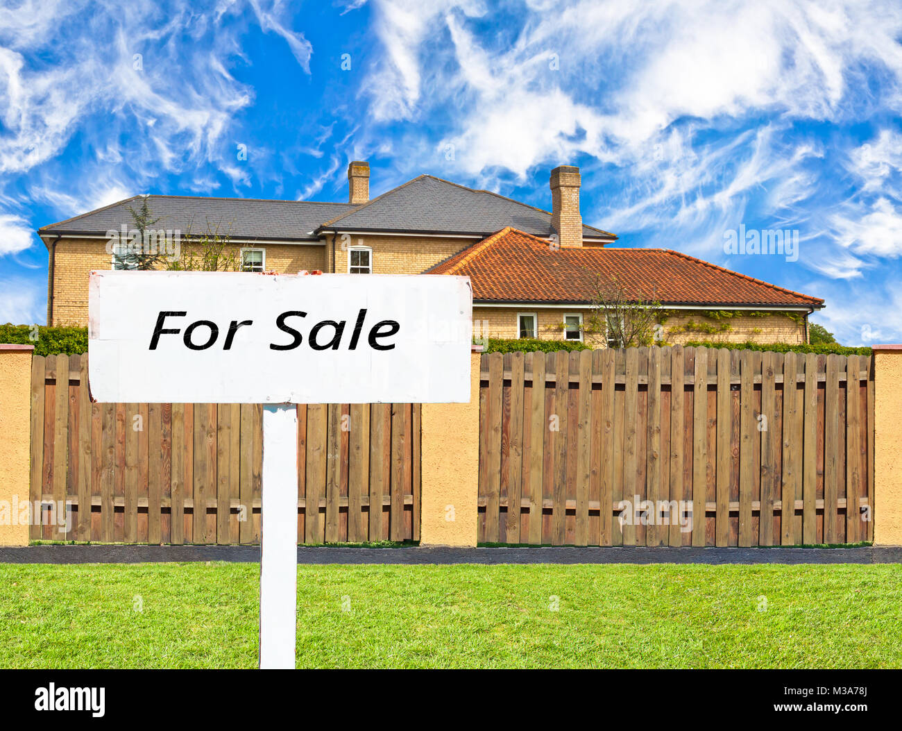 House for sale behind the fence Stock Photo Alamy