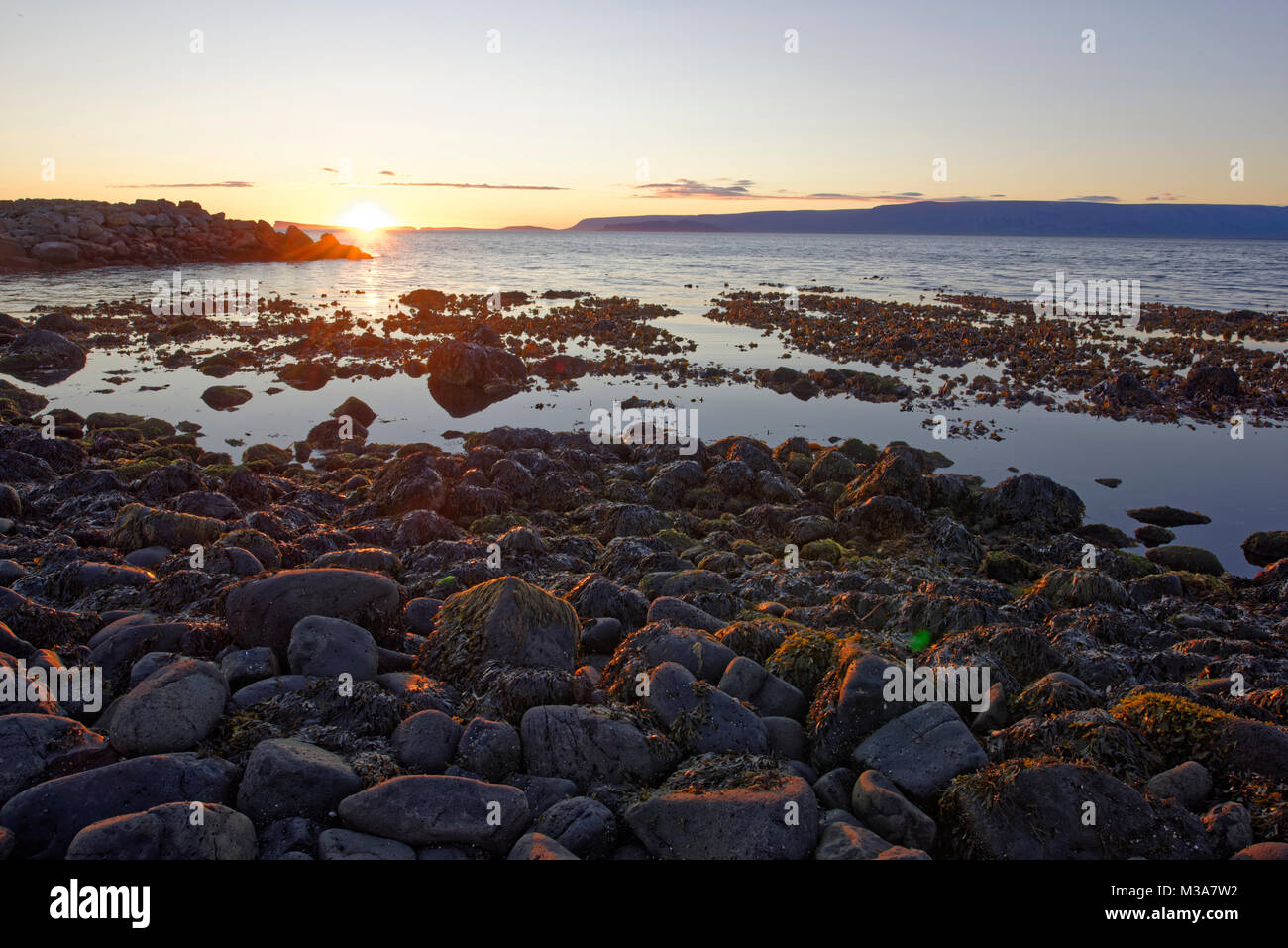 Sunset in Drangey.The island Drangey sits in the middle of Skagafjordur fjord in the north of Iceland. Stock Photo