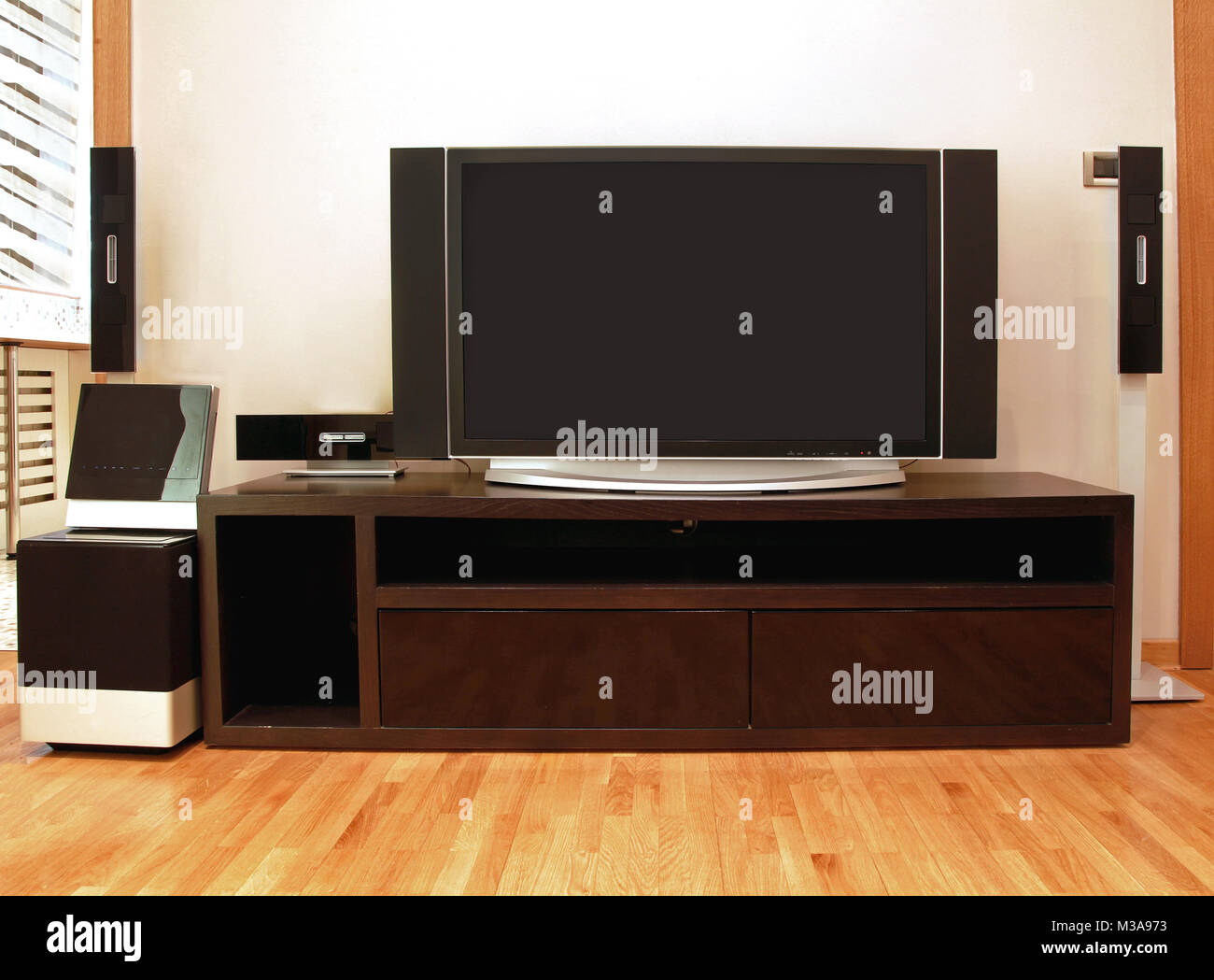Home entertainment unit with plasma TV and surround speakers Stock