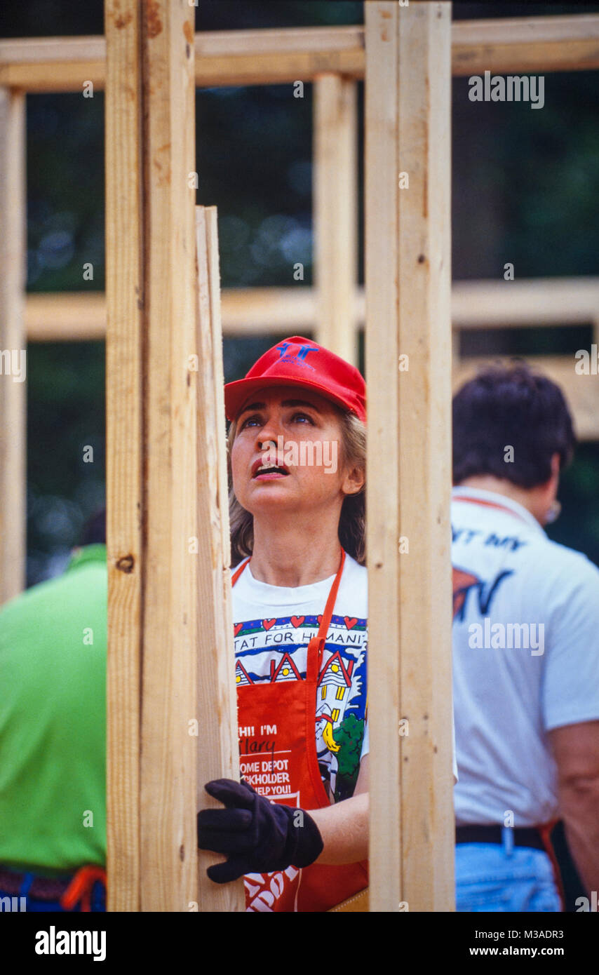 Hillary Clinton works to frame a house during a Habitat for Humanity house in Atlanta, Georgia. The build included volunteers such as Bill, Chelsea and Hillary Clinton, Al and Tipper Gore and Jimmy and Rosalynn Carter. Stock Photo