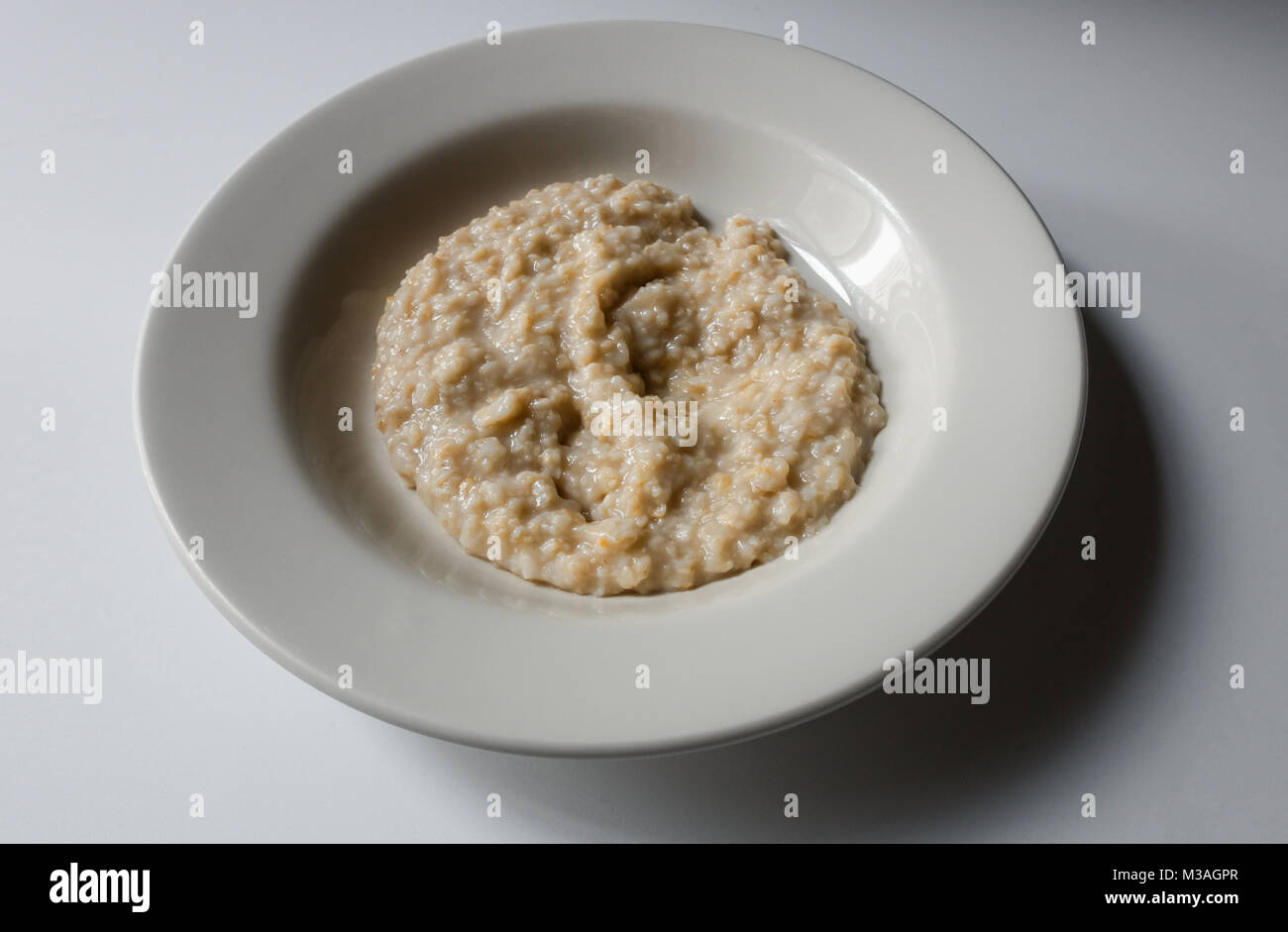 A bowl of porridge (oatmeal) Stock Photo