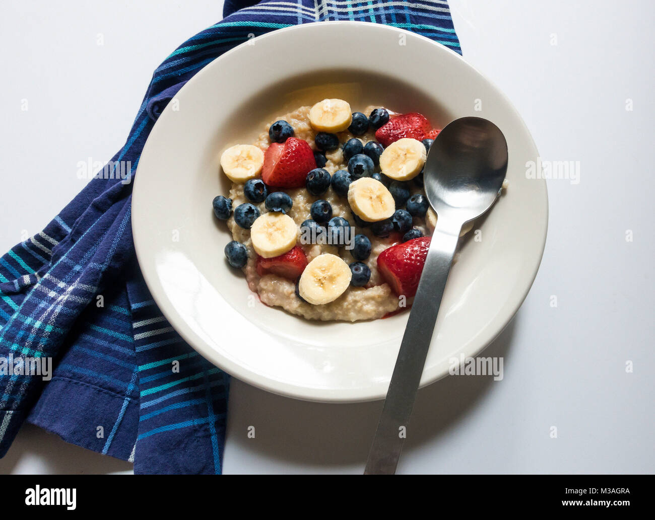 A bowl of porridge and fruit Stock Photo
