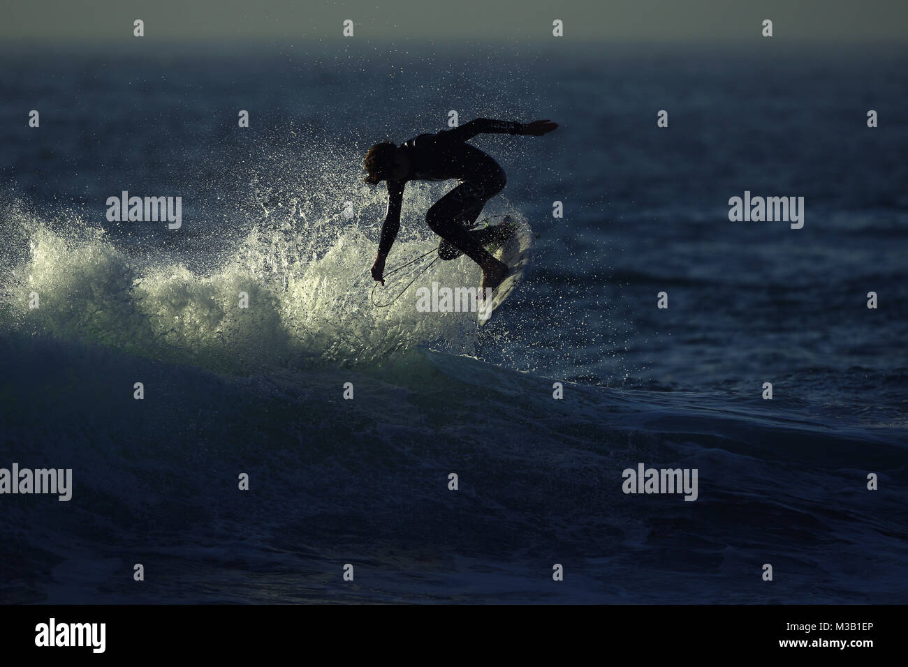 San Diego, CA, USA. 9th Feb, 2018. February 9, 2018- San Diego, California, USA- A surfer rides a wave at sunset at Windansea Beach in the La Jolla area of San Diego, CA, on Feb. 9, 2018. Credit: KC Alfred/ZUMA Wire/Alamy Live News Stock Photo