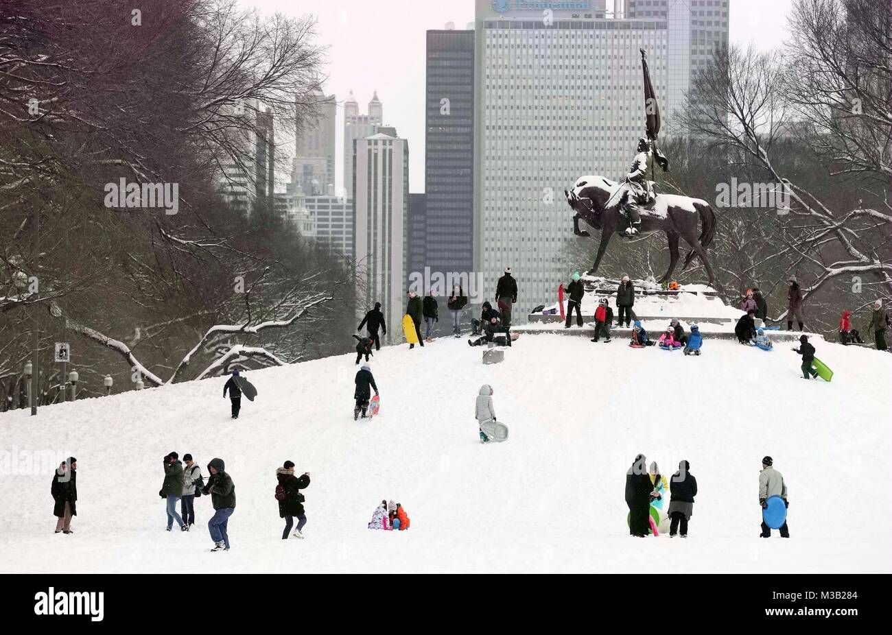 Chicago, USA. 9th Feb, 2018. People enjoy snow at Grant Park in Chicago, the United States, on Feb. 9, 2018. Credit: Wang Ping/Xinhua/Alamy Live News Stock Photo