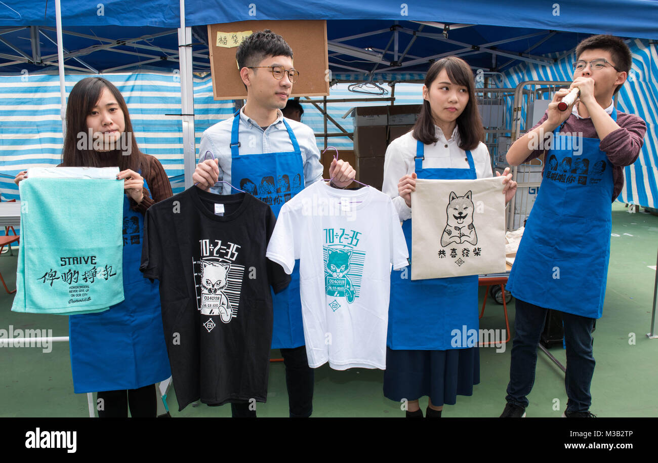 February 10, 2018 - Hong Kong, Hong Kong SAR, CHINA - HONG KONG SAR: CHINA - February 10, 2018. Hong Kong Lunar New Year Fair opens in Victoria Park. The Chinese New Year fair, traditionally filled with flower and gift stalls, is also home to political parties as they fund raise to continue their work. With up to a million people expected each year, the fair is a perfect venue for the political activists.At the Demosisto stand student activists (LtoR) TIffany Yuen Ka Wai, Nathan Law Kwun Chung (Chairman), Agnes Chow Ting and Joshua Wong show off their merchandise (Credit Image: © Jayne Russell Stock Photo