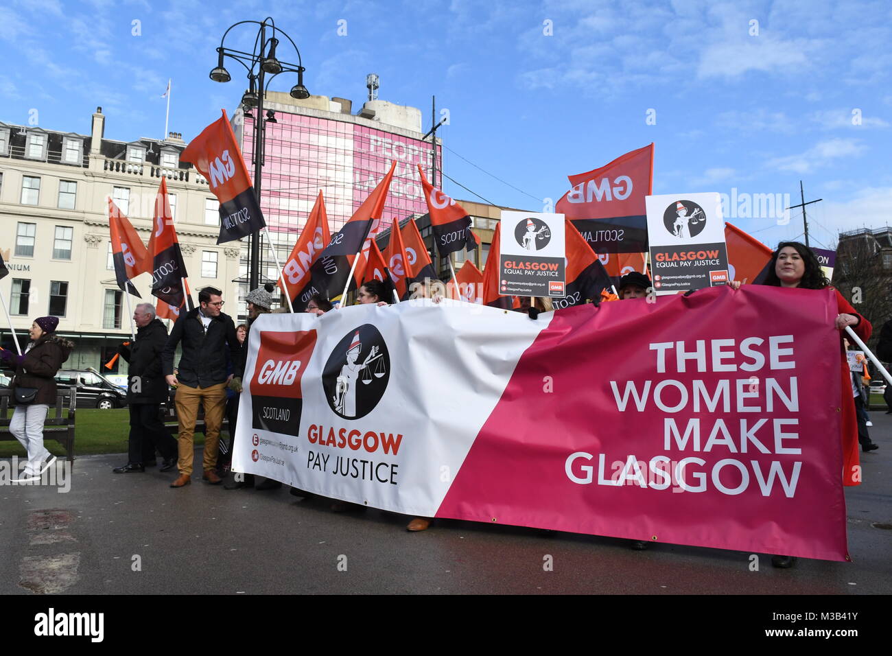 Glasgow, Scotland, UK - 10 February 2018: Women (and men) demonstrating at an equal pay protest in Glasgow, led by women dressed as suffragettes Stock Photo