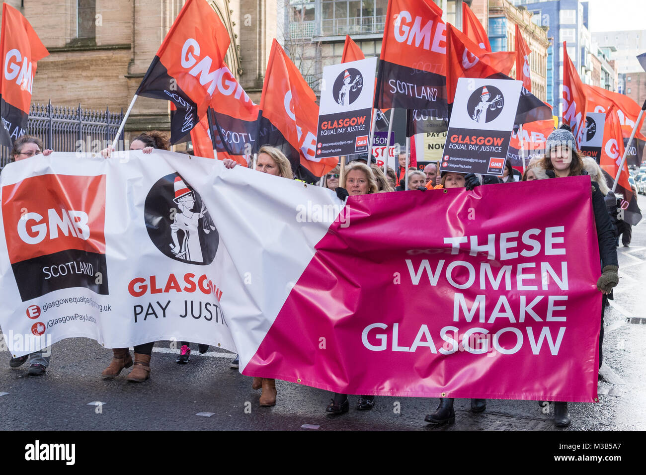 Glasgow, Scotland, UK - 10 February 2018: Women (and men) demonstrating at an equal pay protest in  Glasgow, led by women dressed as suffragettes Credit: Kay Roxby/Alamy Live News Stock Photo