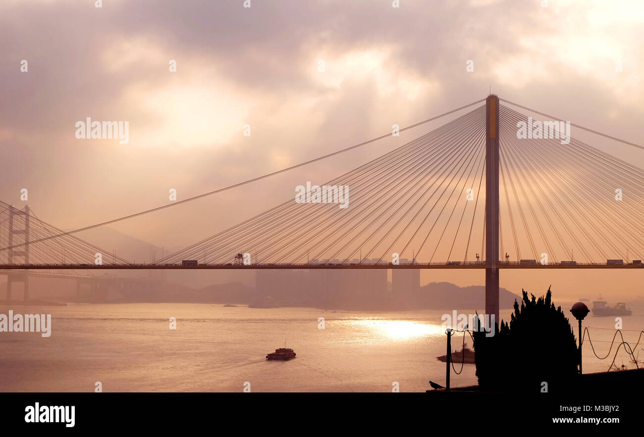 The silhouette of Hong Kong highway bridge building before sunset Stock ...