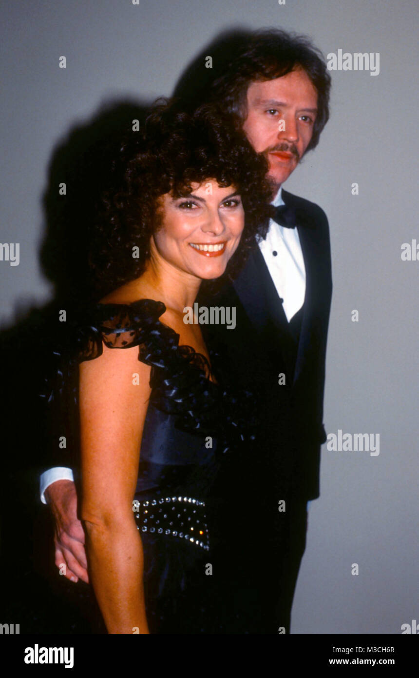 LOS ANGELES, CA - NOVEMBER 19: (L-R) Actress Adrienne Barbeau and director John Carpenter attend Scott Newman Foundation event at Century Plaza Hotel on November 19. 1982 in Los Angeles, California. Photo by Barry King/Alamy Stock Photo Stock Photo