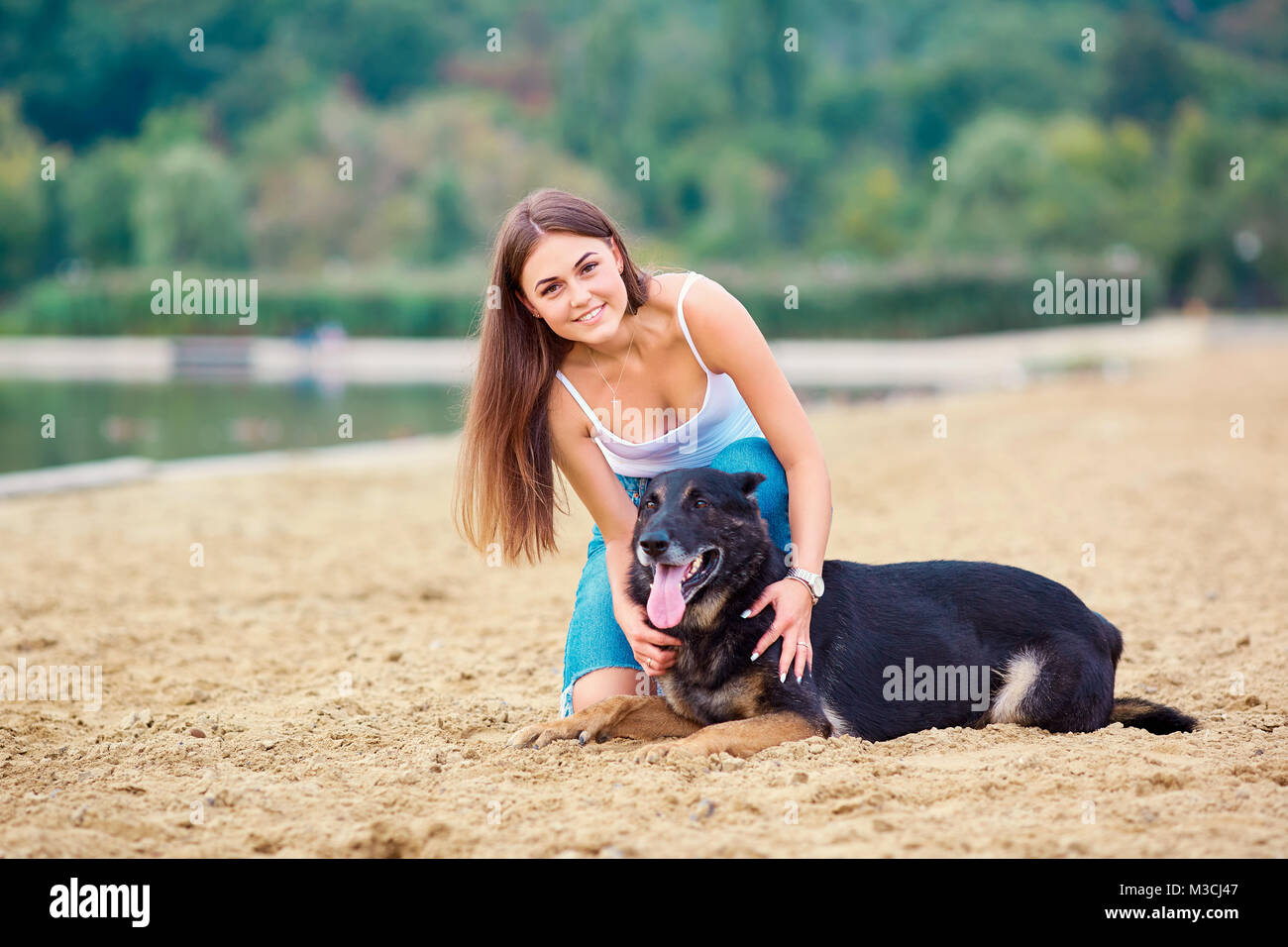 Girl with a dog in the park Stock Photo - Alamy