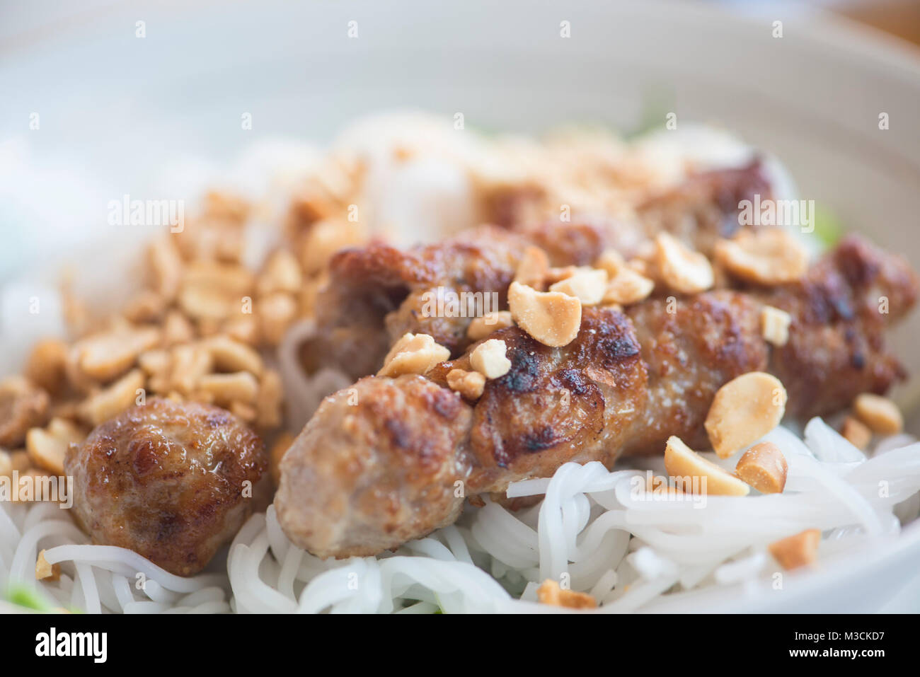 Vietnamese pork sausage with peanuts on noodles Stock Photo