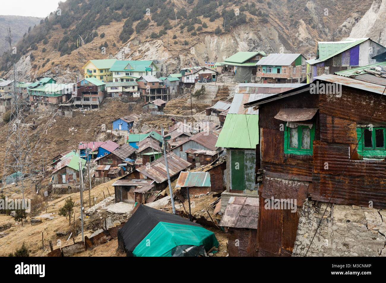 Old buildings on the way from Gantok to Tsomgo Lake high up in the mountains in Sikkim, India Stock Photo