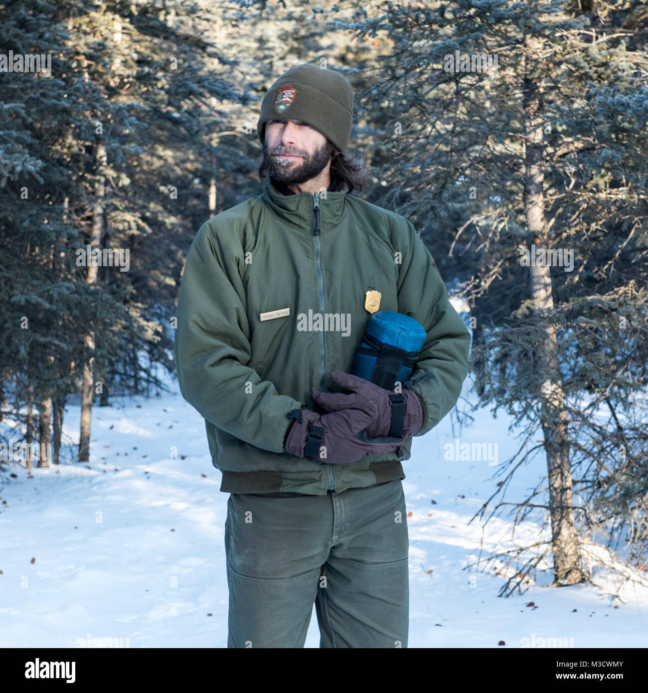 Denali Ranger Michael stands pensively in a winter setting. Stock Photo