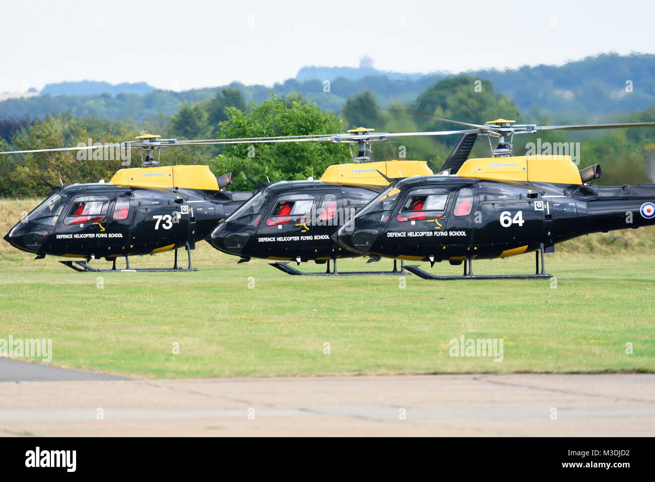 RAF Red Arrows pilots arriving at an airshow in Defence Helicopter Flying School Eurocopter AS350BB Ecureuil Squirrel helicopters Stock Photo