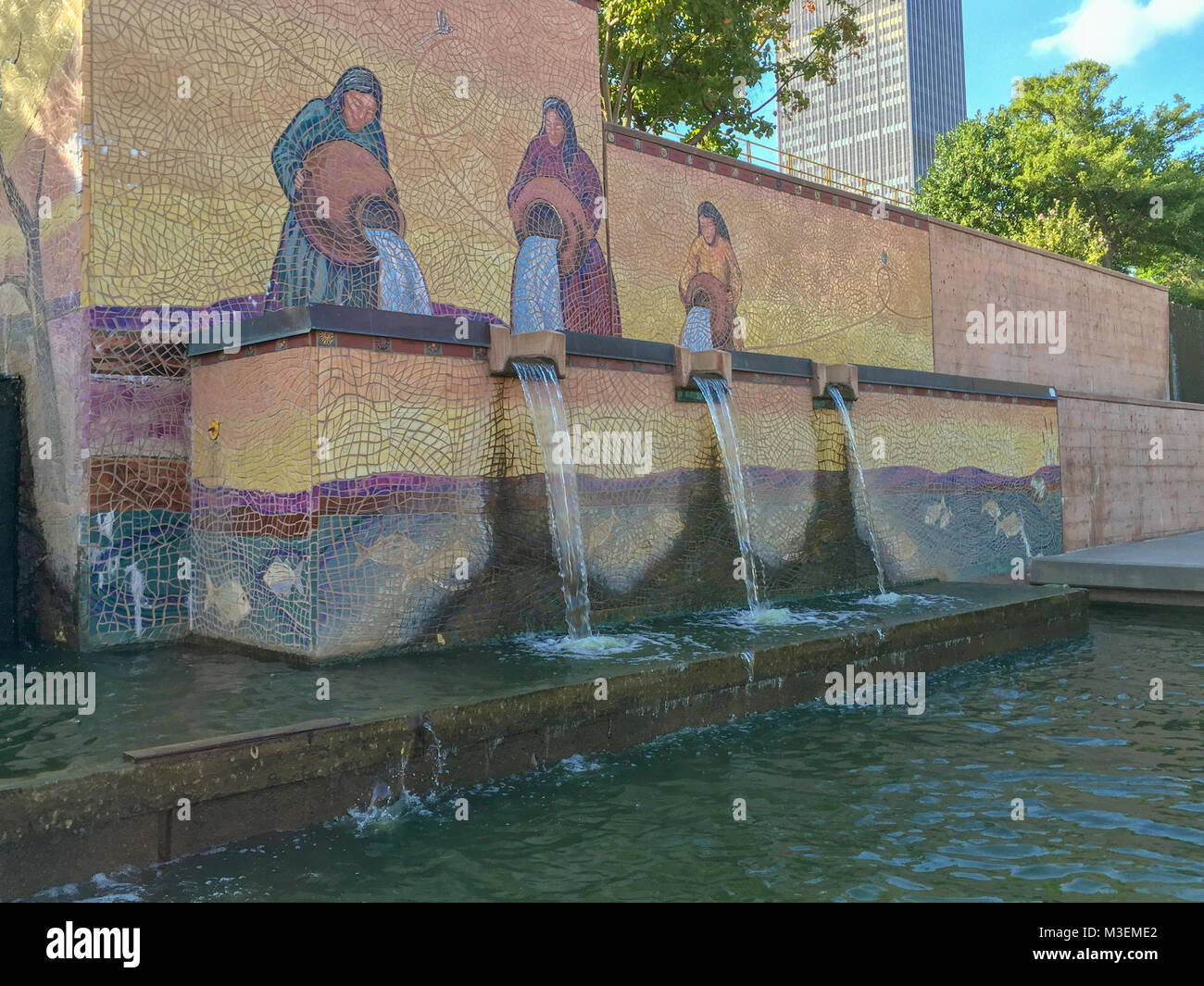 Oklahoma City, Oklahoma / September 27, 2015: This mosaic is depicting women pouring water out of large terracotta urns on the man made canal waterway Stock Photo