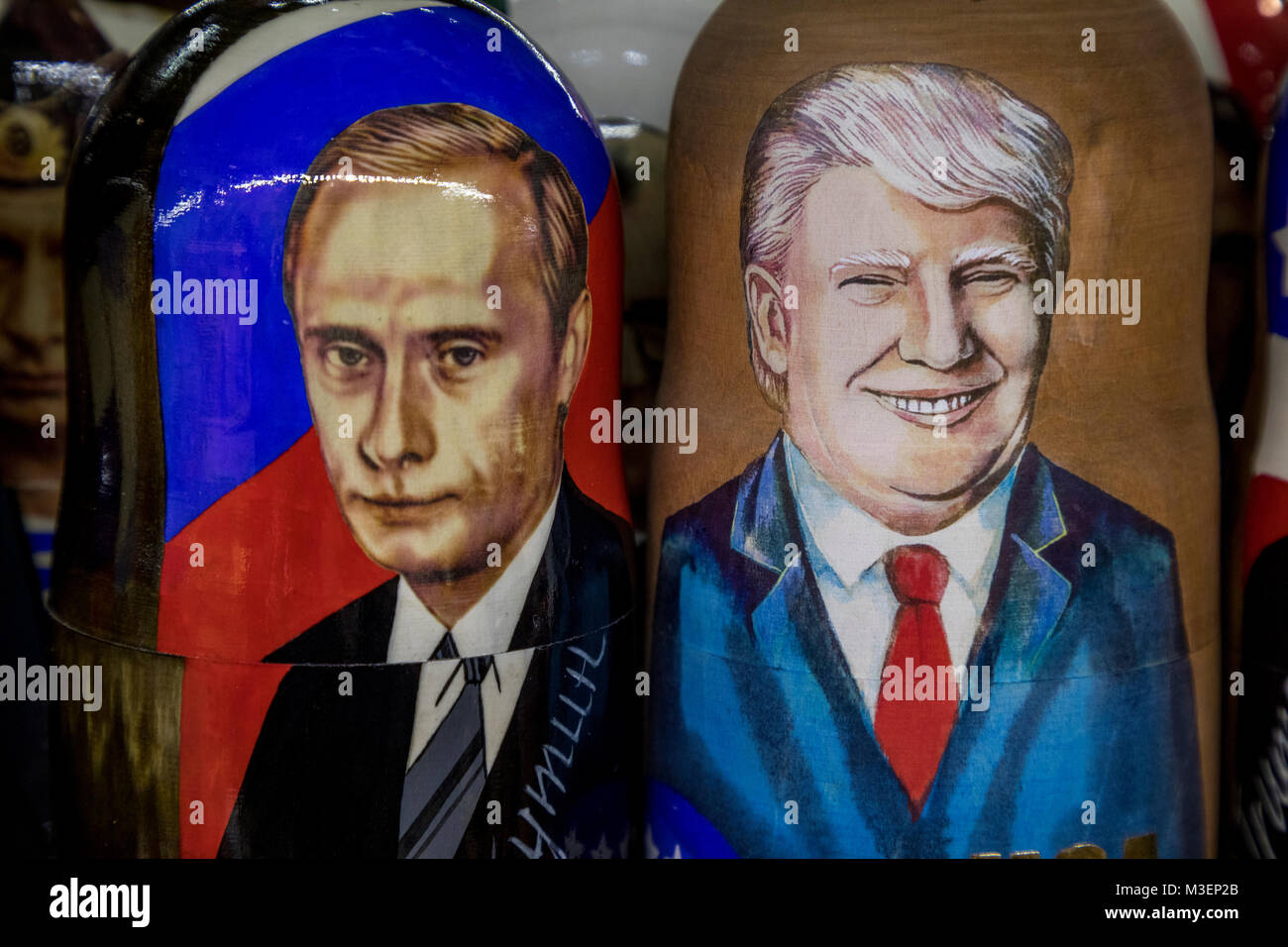 Russian traditional toys - Matryoshka with a portrait of presidents Donald Trump and Vladimir Putin in souvenir kiosk on the Red square in Moscow Stock Photo
