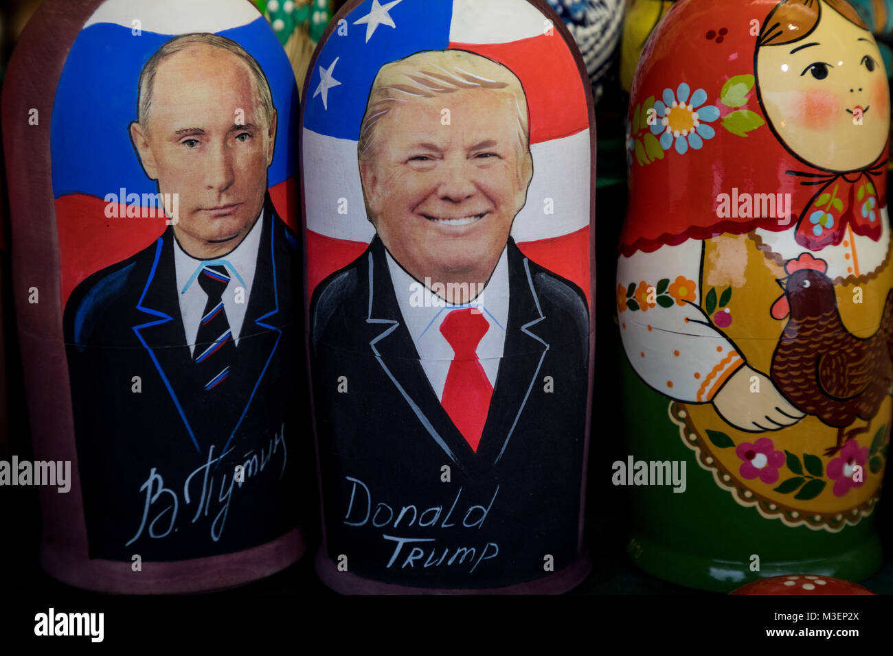 Russian traditional toys - Matryoshka with a portrait of presidents Donald Trump and Vladimir Putin in souvenir kiosk on the Red square in Moscow Stock Photo