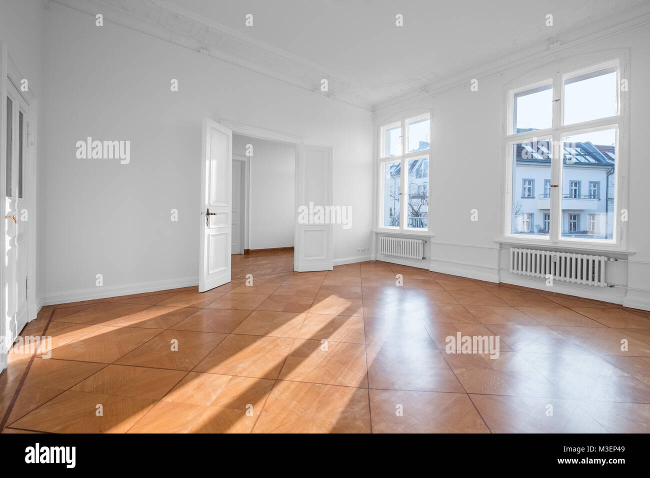 empty apartment room - flat for rent with wooden floor - Stock Photo
