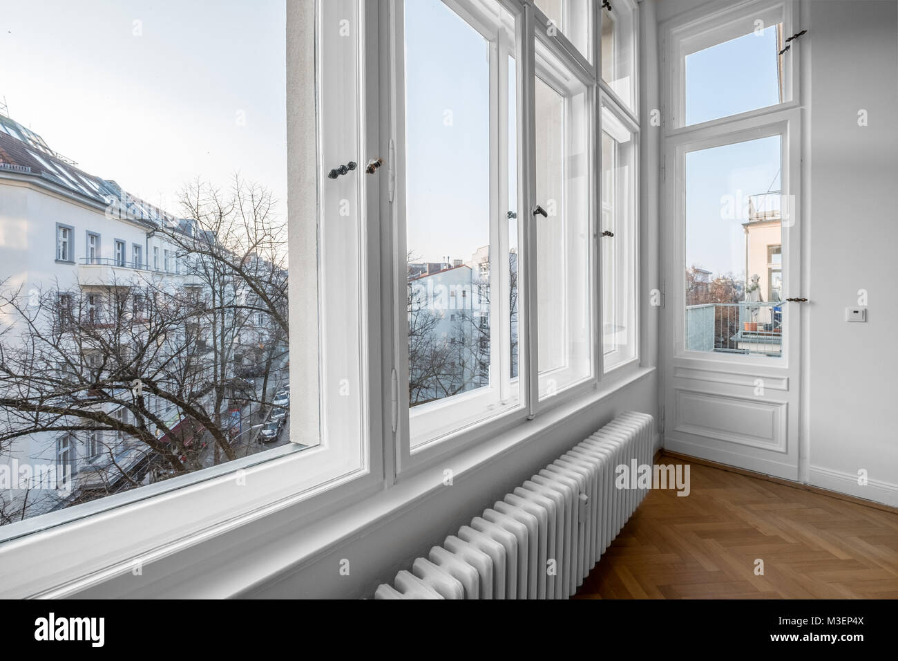 window, old wooden double windows in turn of the century building, Stock Photo
