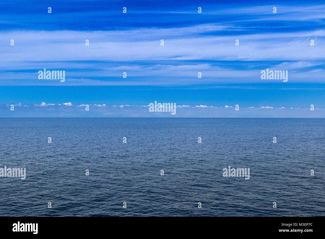 Seascape showing blue sea and sky with a horizon Stock Photo - Alamy