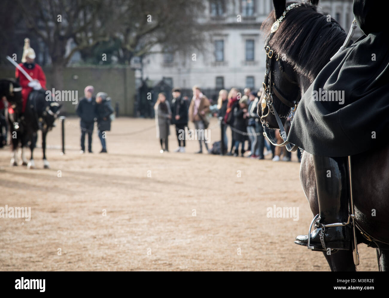 Members of the Queen's Royal Horse Guards on horses, riding to the