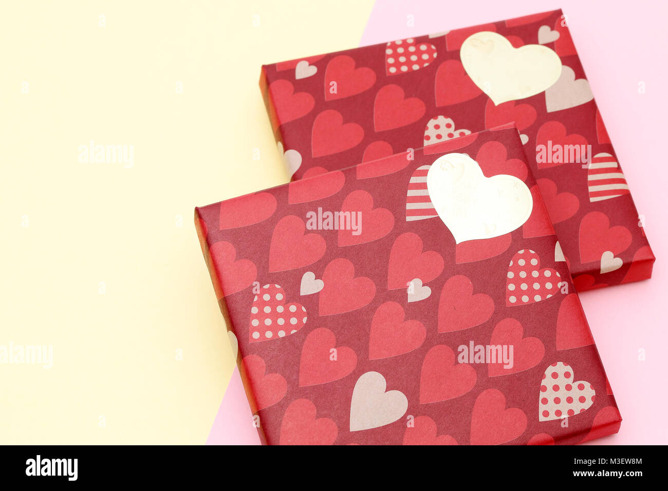 Valentine's Day concept. Gift with bow on the yellow background Stock Photo