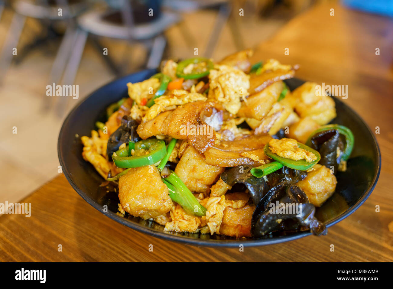 Close up shot of a Asian style dish of fry porks, egg, vegtables, ate at Los Angeles Stock Photo