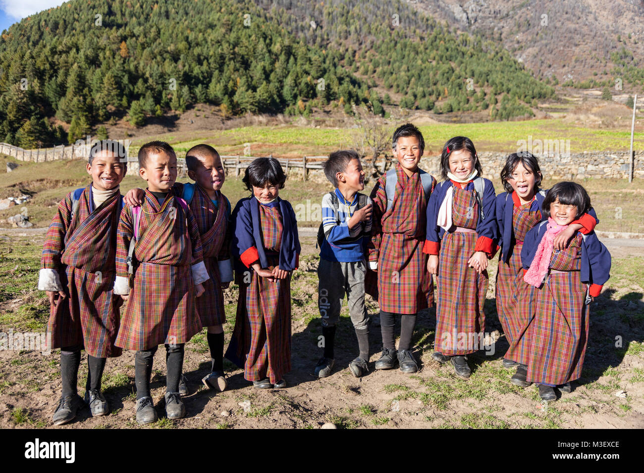 Phobjikha, Bhutan.  Kikorthang Village.  Schoolchildren Wearing Traditional Gho Outfits. Stock Photo