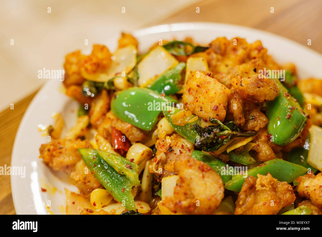 Close up shot of chicken with szechwan pepper and green pepper, ate at Los Angeles Stock Photo