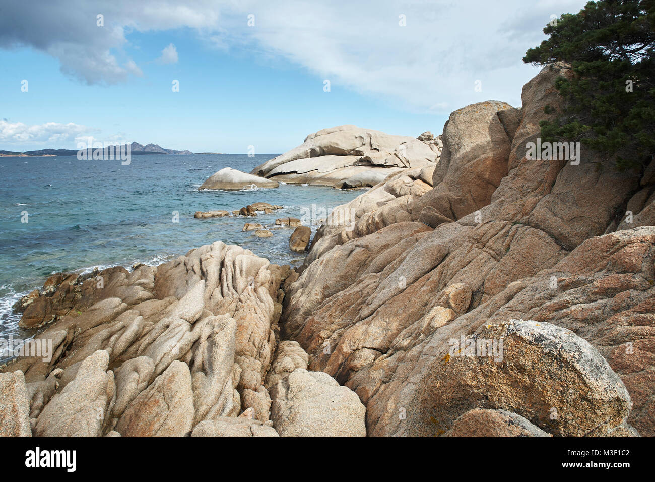 Sardinian Remarkable Rocks Climbing the distinctive rocks along the coastline of Sardinia Stock ...