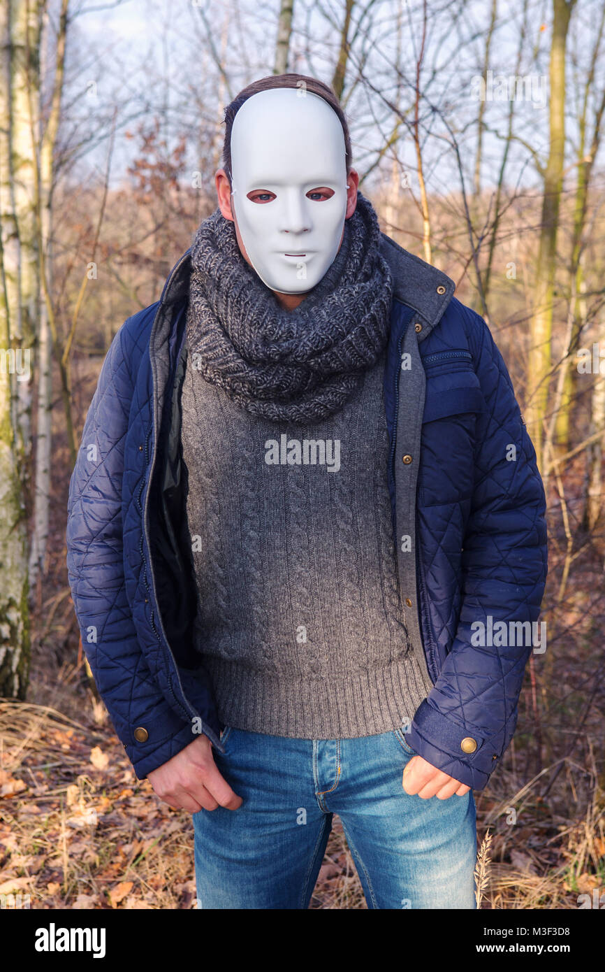 man with white mask standing outdoors in the woods Stock Photo - Alamy
