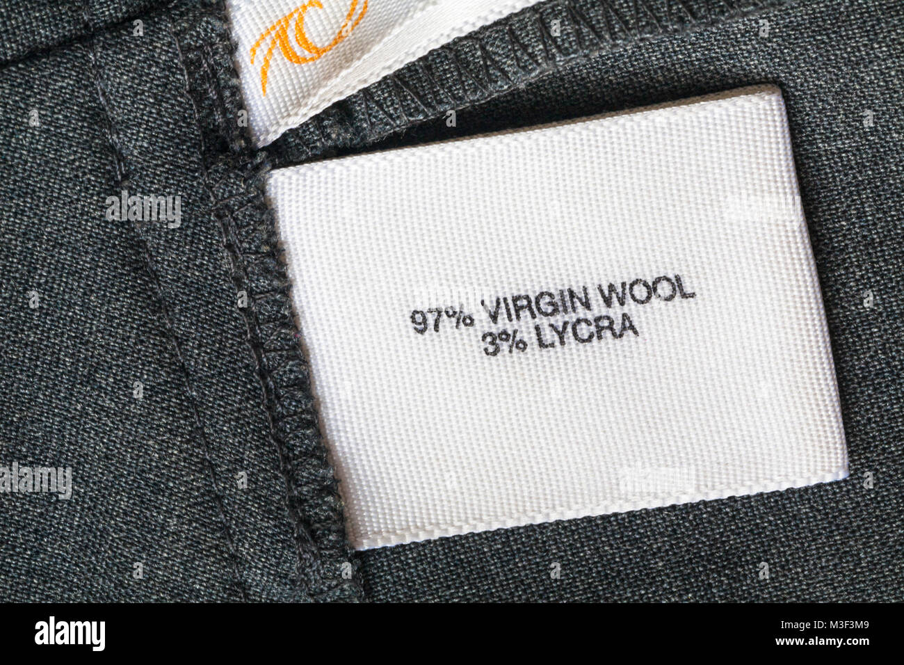 97% virgin wool 3% lycra label in clothing garment Stock Photo - Alamy