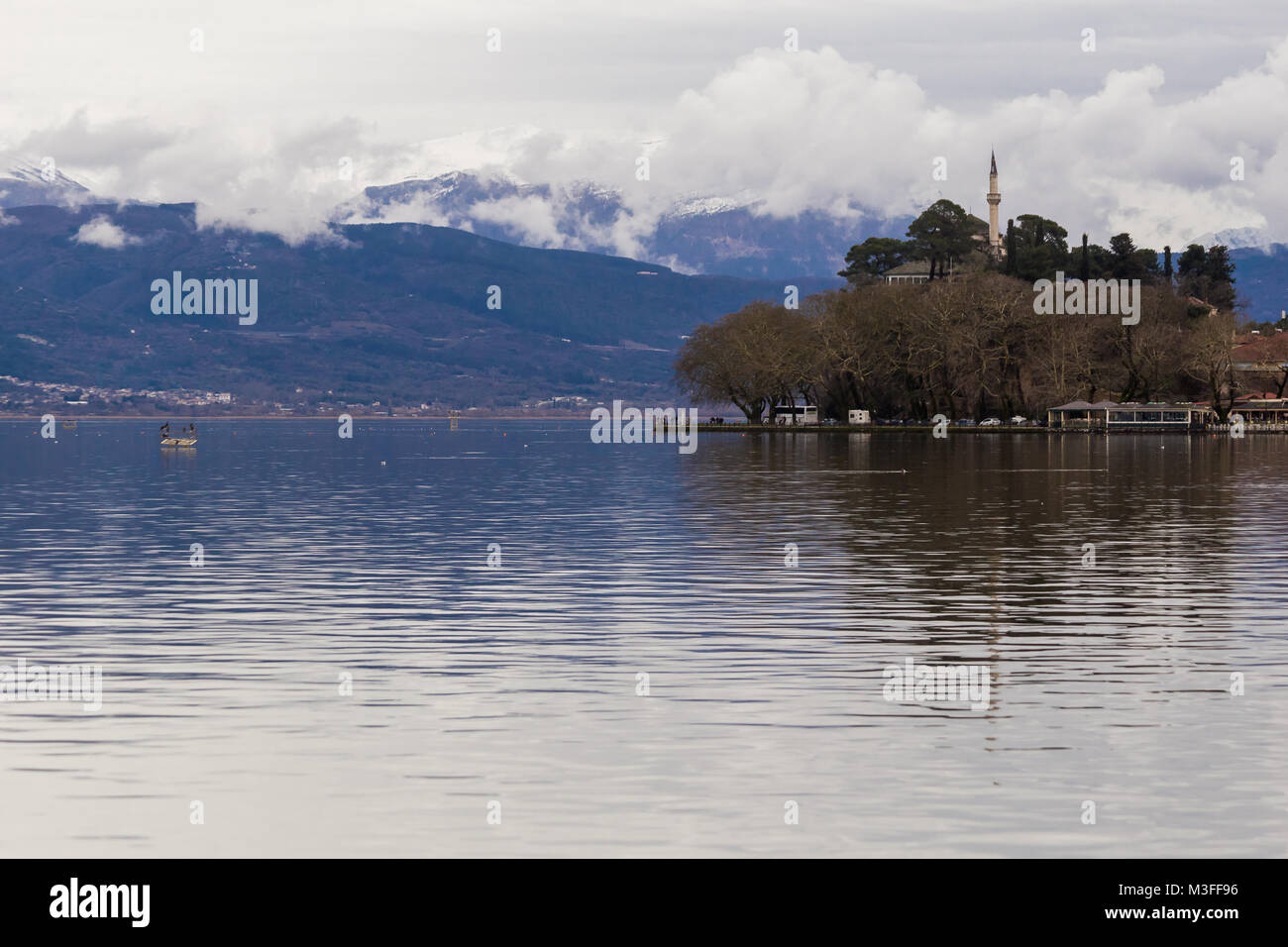 Ioannina lake called 'Pamvotis' in a winter cloudy foggy day Stock Photo