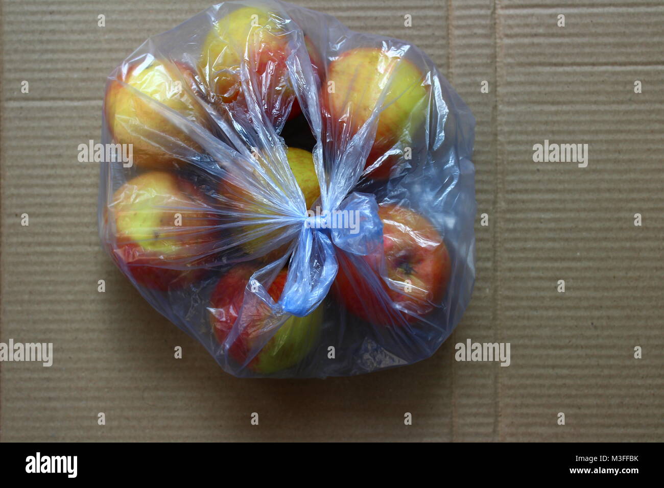 Apples in polythene bag Stock Photo