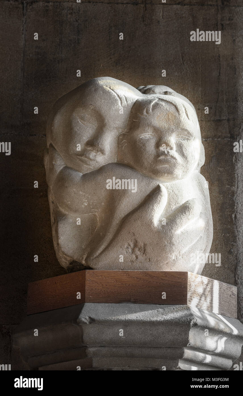 Stone sculpture of mother and child (Mary and her son Jesus Christ), an example of religious art at the medieval cathedral of Lincoln, England. Stock Photo