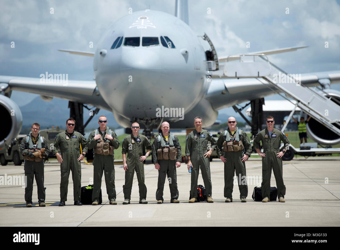 A U.S. Air Force B1-B Lancer crew with the 37th Expeditionary Bomb Squadron, Andersen Air Force Base, Guam, stand for a group Stock Photo