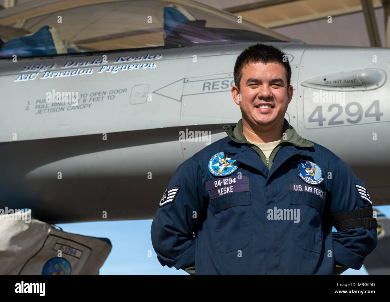Staff Sgt. Drake Keske, 309th Aircraft Maintenance Unit dedicated crew chief, poses for a portrait in front of his assigned aircraft at Luke Air Force Base, Ariz., Jan. 25, 2018.  Assigned to an F-16 Fighting Falcon, Keske is one of many technically proficient maintenance professionals from the 309th AMU. The name of the DCC and assistant DCC are displayed alongside their assigned aircraft in honor of their dedication. (U.S. Air Force Stock Photo