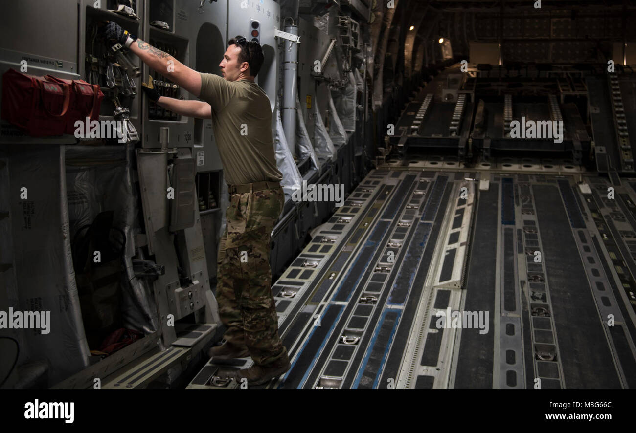 A U.S. Air Force C-17 Globemaster III loadmaster, assigned to the 816th Expeditionary Airlift Squadron, conducts a pre-flight inspection at Al Udeid Airbase, Qatar, Jan. 25, 2018. C-17 loadmasters ensure cargo is safely and securely transported and are responsible for ensuring the rapid strategic delivery of troops and all types of cargo. (U.S. Air Force Stock Photo