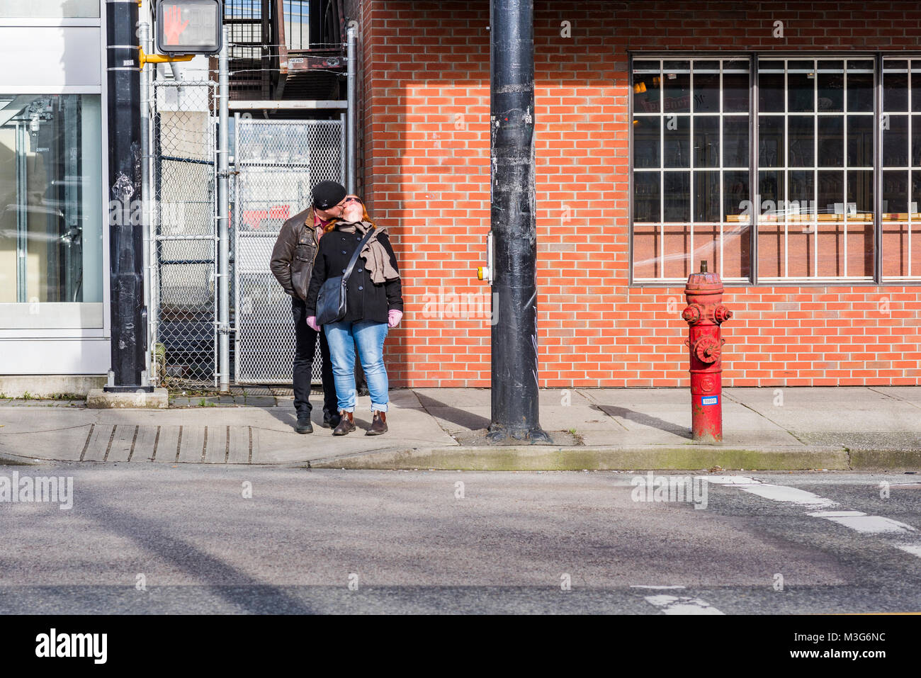 PDA. a public display of affection. A kiss while waiting for the light