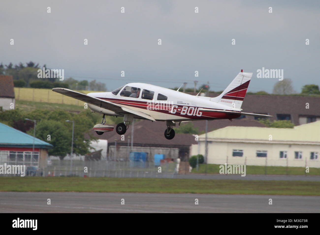 G-BOIG, a privately-owned Piper PA-28-161 Warrior II, departing Prestwick Airport in Ayrshire. Stock Photo