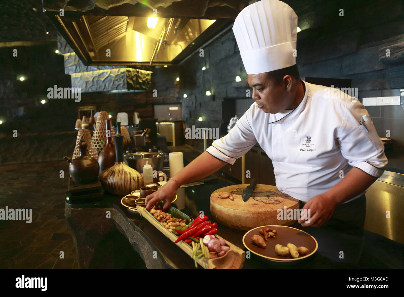 A chef preparing Indonesian cuisine in his kitchen in the RitzCarlton