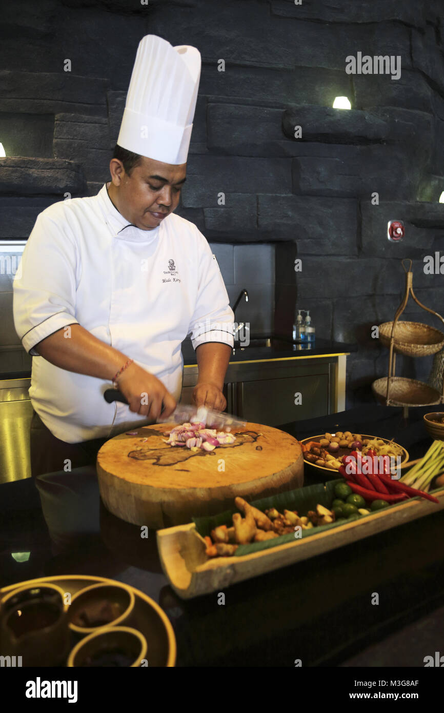 A chef preparing Indonesian cuisine in his kitchen in the RitzCarlton