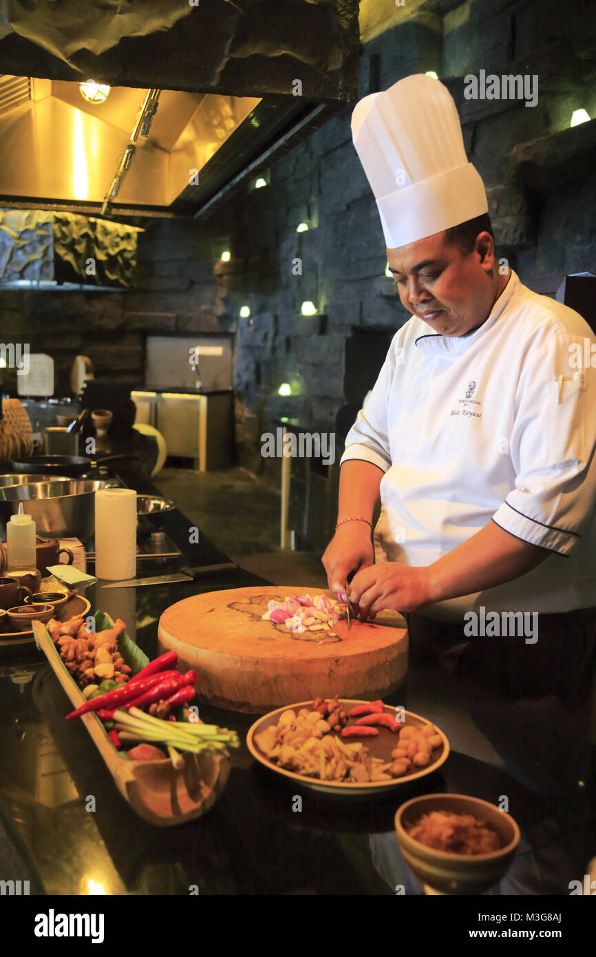 A chef preparing Indonesian cuisine in his kitchen in the RitzCarlton