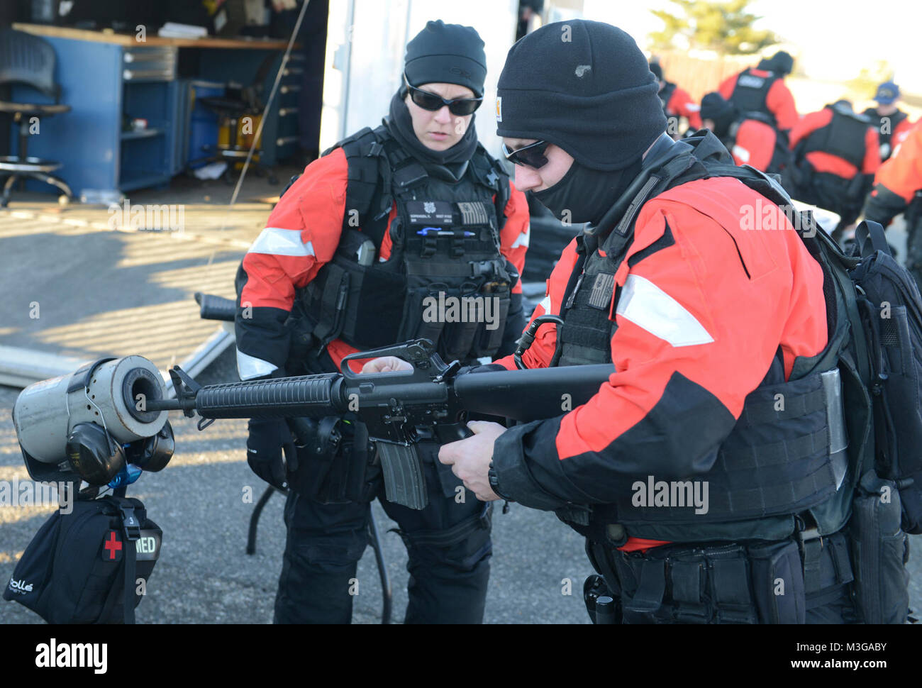 Coast Guard Maritime Safety and Security Team members safely load